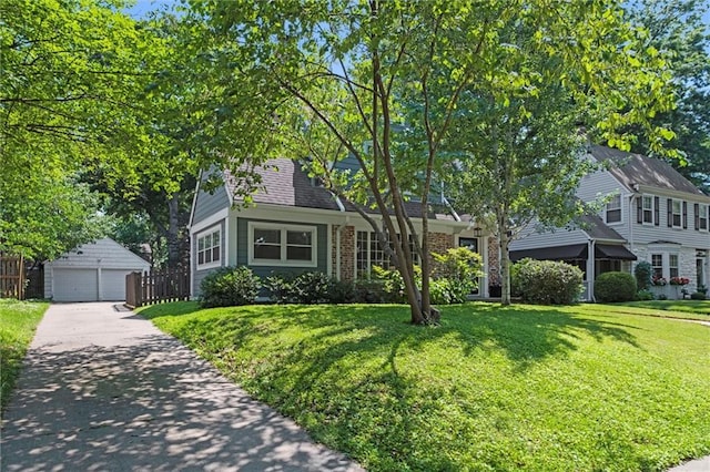 611 E 64th Ter, Kansas City, MO 64131 - view of front of property featuring a garage, an outdoor structure, and brick siding