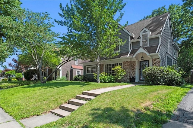 611 E 64th Ter, Kansas City, MO 64131 - view of front facade with a front lawn and brick siding