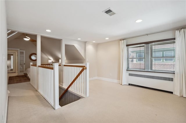 6661 Locust St, Kansas City, MO 64131 - hall featuring radiator, carpet floors, an upstairs landing, recessed lighting, and baseboards