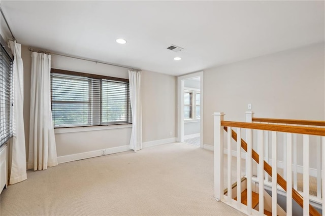 6661 Locust St, Kansas City, MO 64131 - spare room featuring light colored carpet, recessed lighting, and baseboards