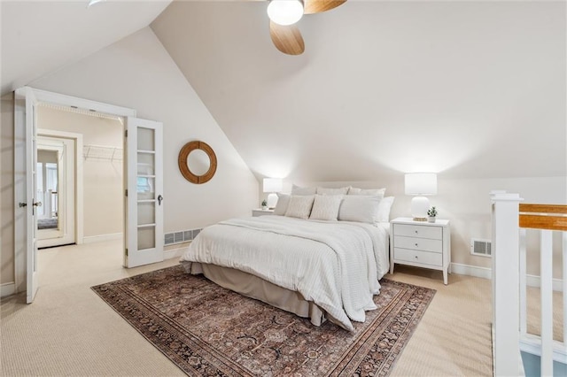 6661 Locust St, Kansas City, MO 64131 - bedroom with light colored carpet, french doors, lofted ceiling, and ceiling fan