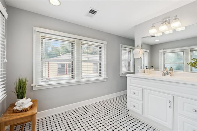 6661 Locust St, Kansas City, MO 64131 - bathroom featuring vanity, healthy amount of natural light, and baseboards