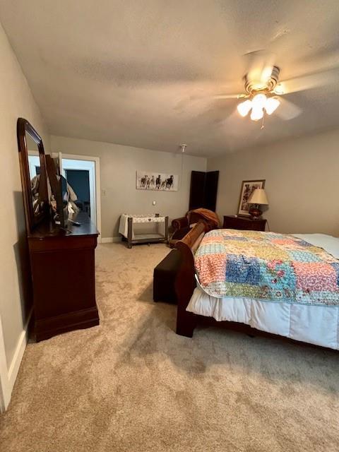217 5th St, Burlington, KS 66839 - carpeted bedroom featuring a ceiling fan and baseboards