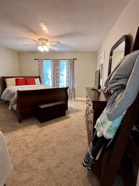 217 5th St, Burlington, KS 66839 - bedroom with light carpet, a ceiling fan, and baseboards