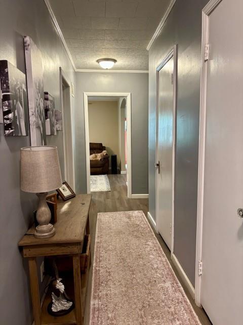 217 5th St, Burlington, KS 66839 - corridor featuring crown molding and baseboards