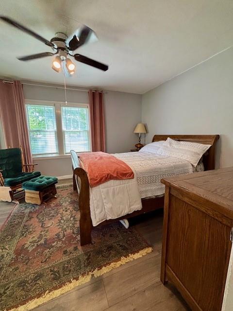 217 5th St, Burlington, KS 66839 - bedroom featuring wood finished floors and ceiling fan