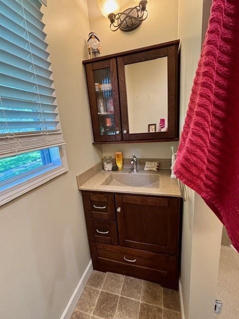 217 5th St, Burlington, KS 66839 - bathroom with vanity and baseboards