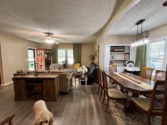 217 5th St, Burlington, KS 66839 - dining room featuring a textured ceiling, plenty of natural light, ceiling fan, and wood finished floors
