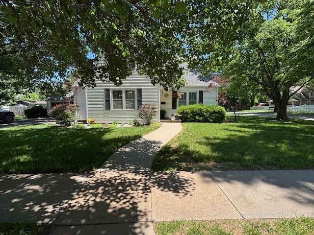 217 S 5th St, Burlington, KS 66839 - view of property hidden behind natural elements with a front lawn