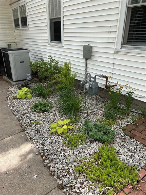 217 S 5th St, Burlington, KS 66839 - exterior view of a cooling unit and gas meter