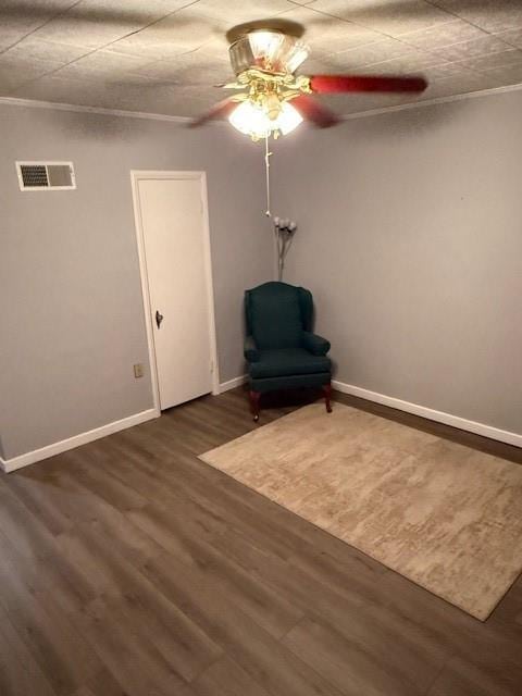 217 S 5th St, Burlington, KS 66839 - unfurnished room with ornamental molding, ceiling fan, and dark wood-style flooring