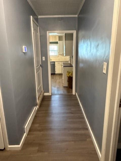 217 S 5th St, Burlington, KS 66839 - hall with crown molding and dark wood-type flooring