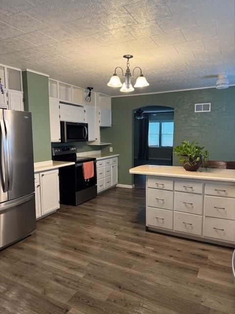 217 S 5th St, Burlington, KS 66839 - kitchen featuring black appliances, white cabinets, a chandelier, and light countertops