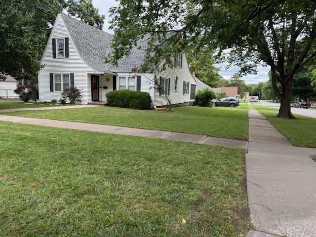 217 S 5th St, Burlington, KS 66839 - view of front facade with a front yard and a shingled roof