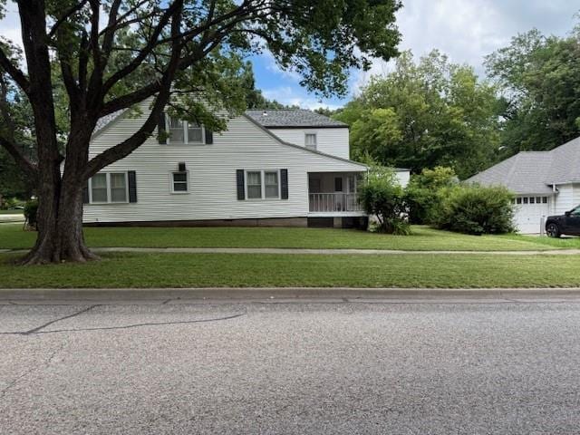 217 S 5th St, Burlington, KS 66839 - view of side of property featuring a yard and a garage