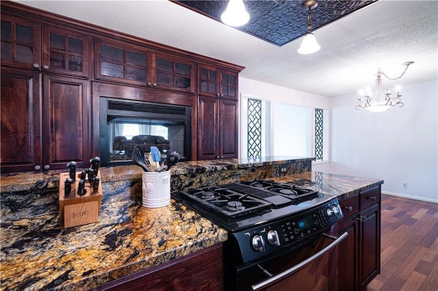 2002 N 29th St, Saint Joseph, MO 64506 - kitchen with black gas stove, dark brown cabinets, dark wood-type flooring, a textured ceiling, and glass insert cabinets