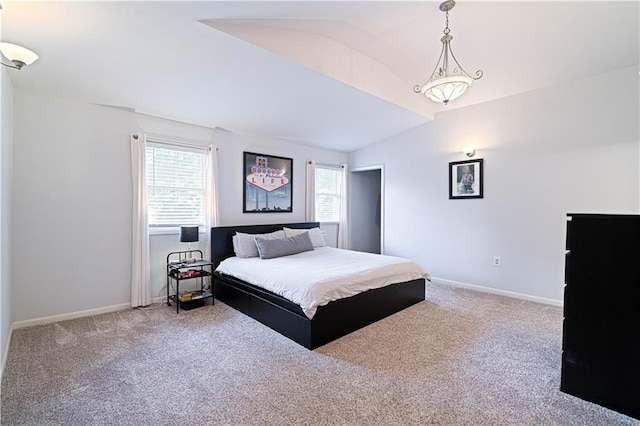 2002 N 29th St, Saint Joseph, MO 64506 - carpeted bedroom featuring vaulted ceiling, multiple windows, and baseboards