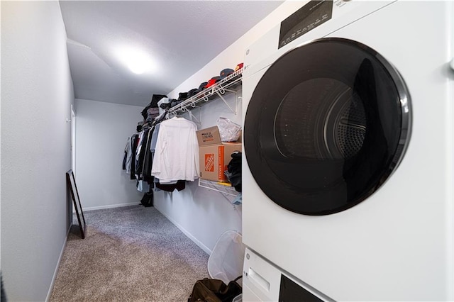 2002 N 29th St, Saint Joseph, MO 64506 - washroom featuring carpet floors, stacked washer / dryer, and baseboards