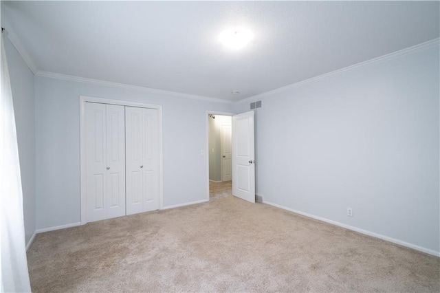 2002 N 29th St, Saint Joseph, MO 64506 - unfurnished bedroom with a closet, carpet floors, ornamental molding, and baseboards
