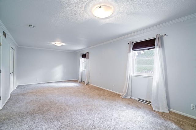 2002 N 29th St, Saint Joseph, MO 64506 - empty room with carpet flooring, crown molding, a textured ceiling, baseboards, and a smoke detector