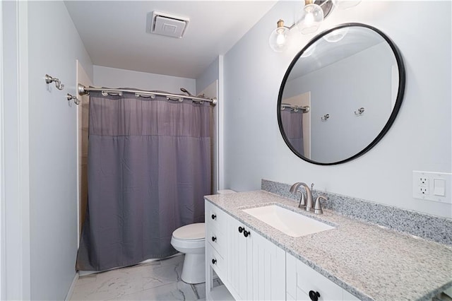 2002 N 29th St, Saint Joseph, MO 64506 - bathroom with marble finish floors, vanity, toilet, and a shower with curtain