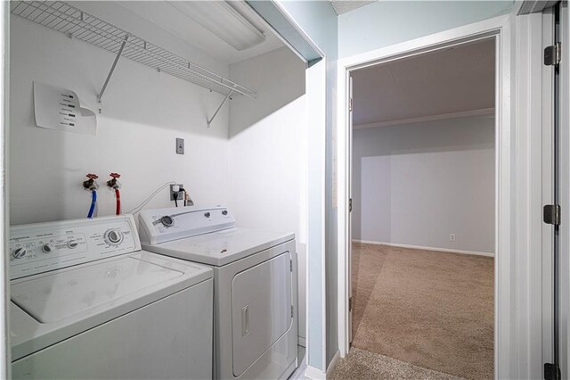 2002 N 29th St, Saint Joseph, MO 64506 - washroom with light colored carpet, washing machine and clothes dryer, and baseboards