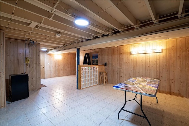 2002 N 29th St, Saint Joseph, MO 64506 - finished basement featuring wood walls, tile patterned floors, and a bar