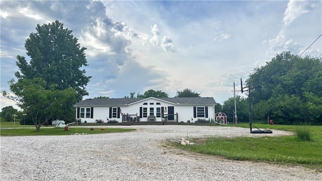 69 Porcupine Path, Linn Valley, KS 66040 - view of front of house with a deck and a front yard