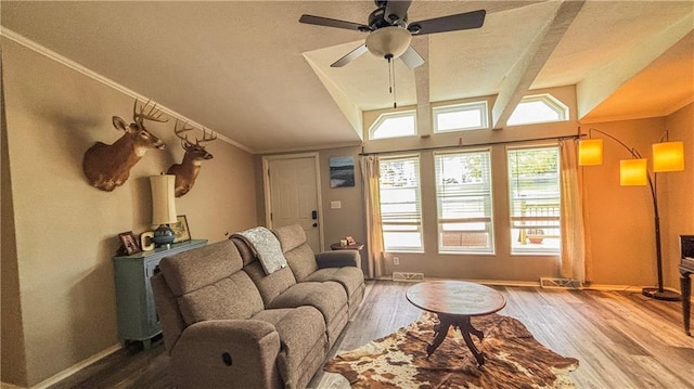 69 Porcupine Path, Linn Valley, KS 66040 - living room with wood finished floors, vaulted ceiling, ceiling fan, crown molding, and baseboards