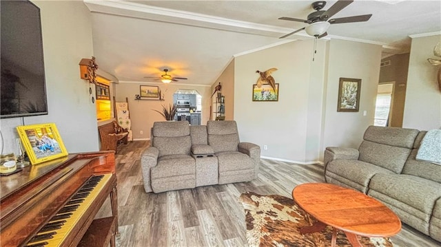 69 Porcupine Path, Linn Valley, KS 66040 - living room featuring a ceiling fan, wood finished floors, ornamental molding, baseboards, and vaulted ceiling