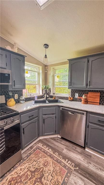 69 Porcupine Path, Linn Valley, KS 66040 - kitchen featuring stainless steel appliances, plenty of natural light, gray cabinets, and vaulted ceiling