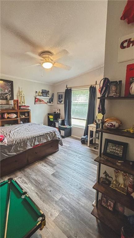 69 Porcupine Path, Linn Valley, KS 66040 - bedroom with a textured ceiling, wood finished floors, ceiling fan, and crown molding