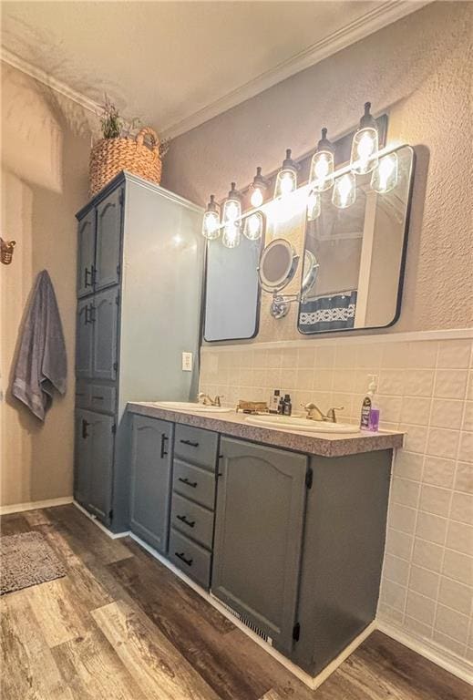69 Porcupine Path, Linn Valley, KS 66040 - full bathroom with wood finished floors, double vanity, ornamental molding, and tile walls