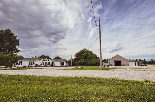 69 Porcupine Path, Linn Valley, KS 66040 - view of grassy yard featuring a detached garage