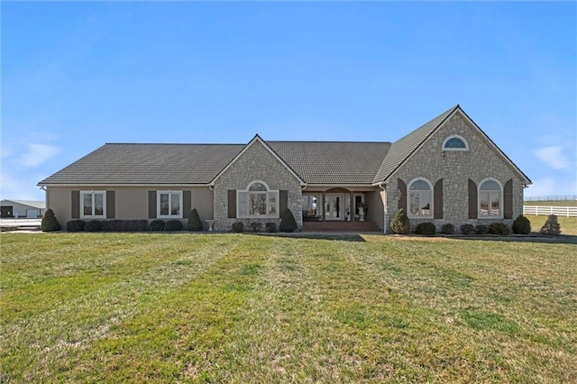 14971 Fairmount Rd, Basehor, KS 66007 - view of front of house with stone siding and a front yard