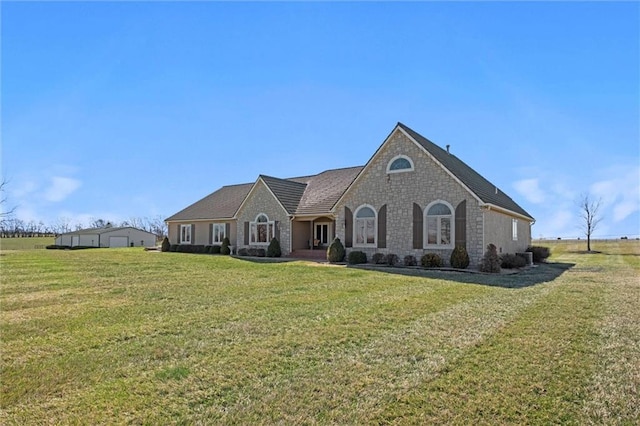 14971 Fairmount Rd, Basehor, KS 66007 - french provincial home featuring stone siding and a front yard