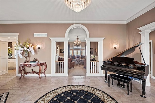 14971 Fairmount Rd, Basehor, KS 66007 - foyer entrance with a chandelier, plenty of natural light, stone tile floors, and crown molding