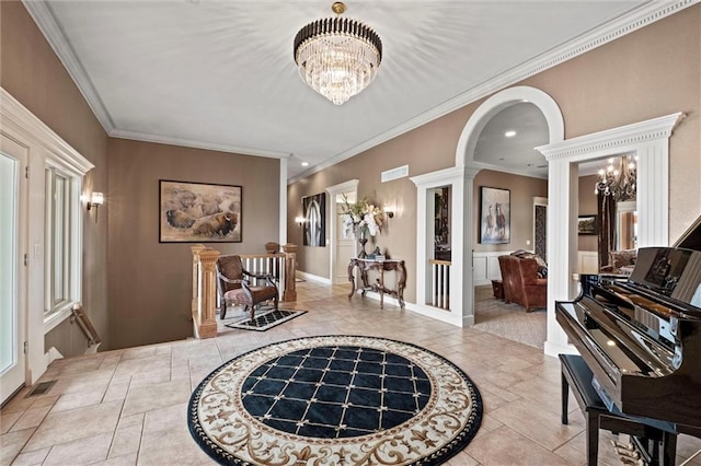 14971 Fairmount Rd, Basehor, KS 66007 - entryway featuring a chandelier, crown molding, arched walkways, baseboards, and recessed lighting