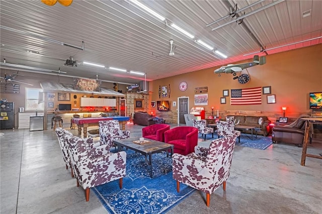 14971 Fairmount Rd, Basehor, KS 66007 - living room featuring concrete flooring and a garage