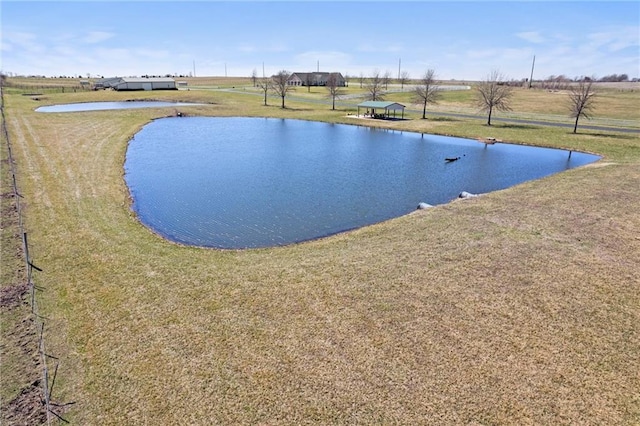 14971 Fairmount Rd, Basehor, KS 66007 - view of swimming pool with a water view and a lawn