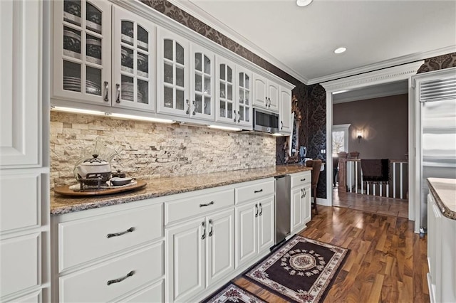 14971 Fairmount Rd, Basehor, KS 66007 - kitchen with white cabinetry, glass insert cabinets, crown molding, light stone countertops, and appliances with stainless steel finishes