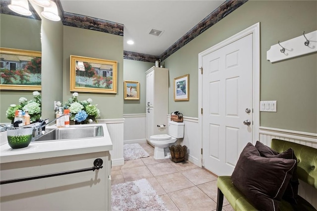 14971 Fairmount Rd, Basehor, KS 66007 - full bathroom with vanity, a wainscoted wall, tile patterned flooring, toilet, and recessed lighting