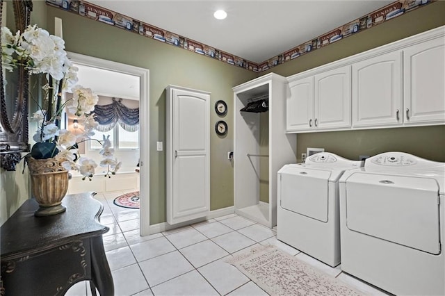 14971 Fairmount Rd, Basehor, KS 66007 - laundry room with cabinet space, washing machine and dryer, and light tile patterned flooring