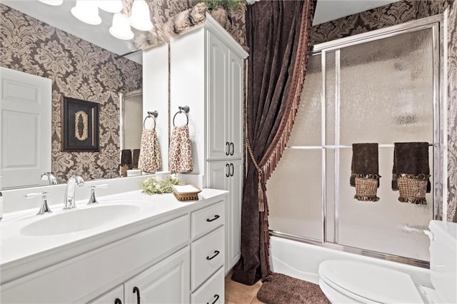 14971 Fairmount Rd, Basehor, KS 66007 - bathroom featuring wallpapered walls, vanity, toilet, shower / bath combination with glass door, and tile patterned flooring