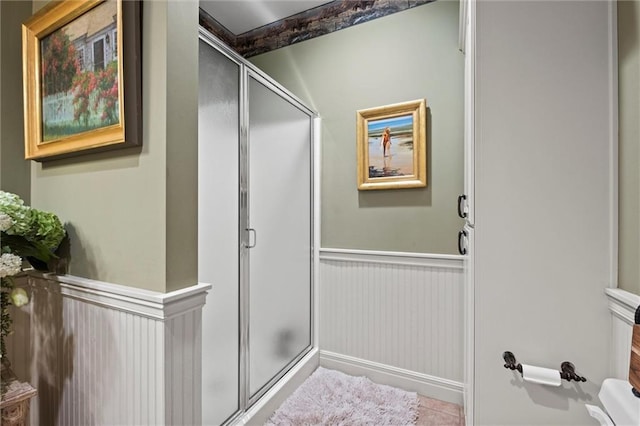 14971 Fairmount Rd, Basehor, KS 66007 - full bath with wainscoting, a shower stall, and tile patterned flooring