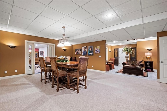 14971 Fairmount Rd, Basehor, KS 66007 - carpeted dining space with baseboards and a paneled ceiling