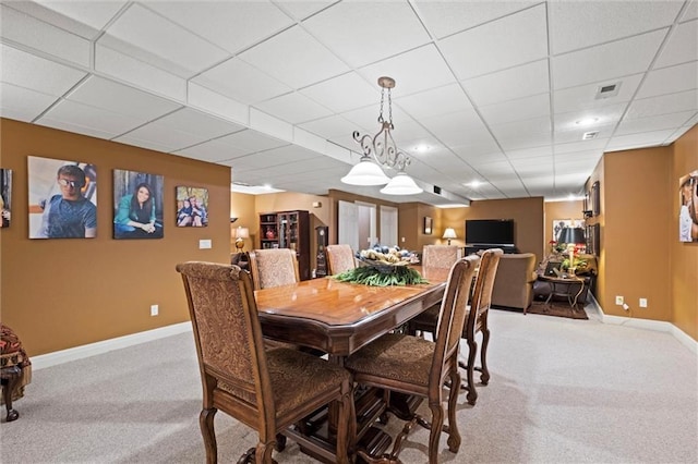 14971 Fairmount Rd, Basehor, KS 66007 - dining area featuring light carpet, baseboards, and a drop ceiling