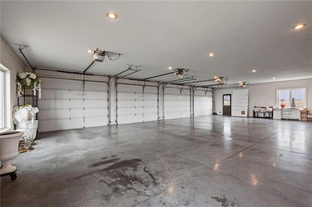 14971 Fairmount Rd, Basehor, KS 66007 - garage featuring a garage door opener and recessed lighting