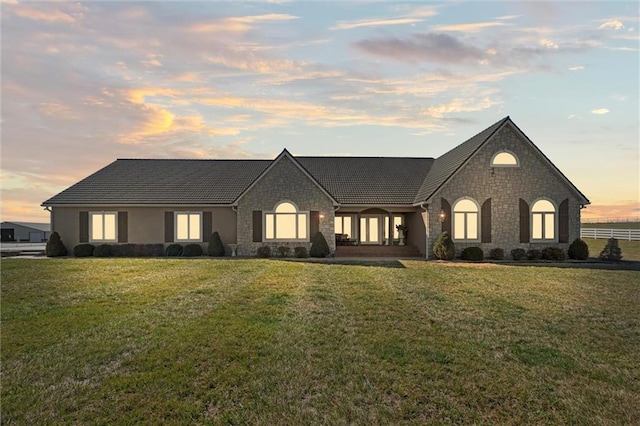 14971 Fairmount Rd, Basehor, KS 66007 - view of front facade with stone siding and a lawn