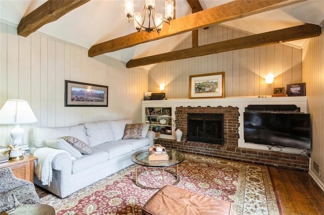 9613 Dearborn St, Overland Park, KS 66207 - living room featuring wood finished floors, a chandelier, wooden walls, and a fireplace